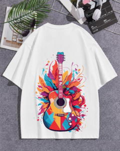 White oversized t-shirt with colorful acoustic guitar explosion graphic featuring vibrant feathers and paint splashes on the back, VenomX streetwear design